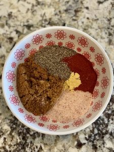 A bowl of herbs and spices for the rub