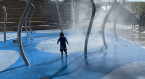 A little boy enjoying some water play