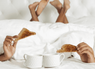 A couple enjoying breakfast in bed