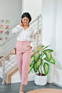 A white blouse paired with pencil pants