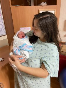 Rachel holding Lily in the hospital
