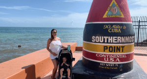 Jessica, pregnant and with her toddler the Southernmost Point in Key West