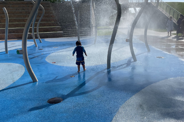 Image: Little boy at local splash pad