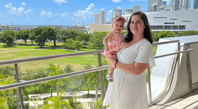 Rachel and her daughter at Frost Science, with the Miami skyline behind them