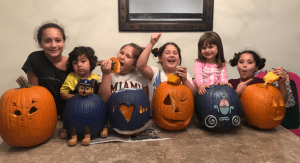 A group of children with their pumpkins
