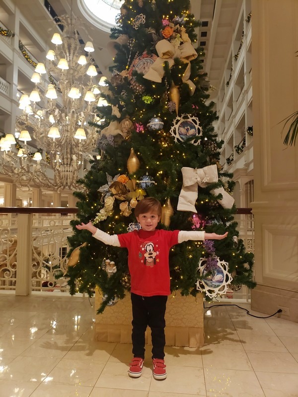 Marcelo in front of one of the Grand Floridian Christmas trees