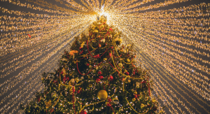 A brlightly lit vintage Christmas tree