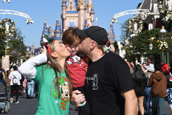 Sandra with her husband and son at Disney's Magic Kingdom