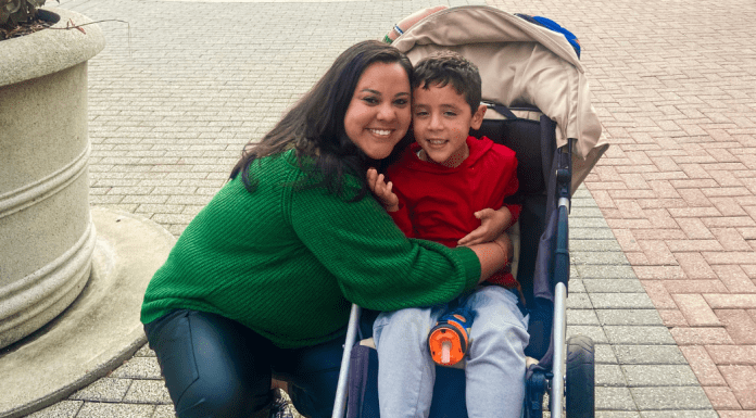 Image of a mother hugging her son on a trip