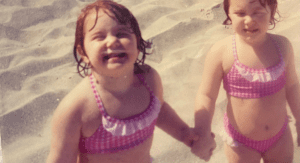 2 toddler girls happy on the beach