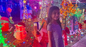 A little girl enjoying a Christmas light display