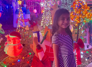 A little girl enjoying a Christmas light display