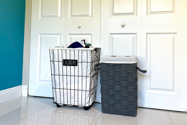 Image: Two small laundry hampers, placed side by side