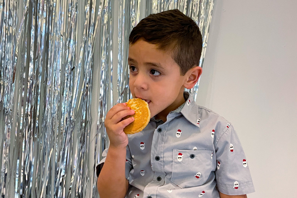 Image of a child eating a their favorite snack