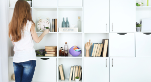 Image: A woman organizing shelves and cabinets