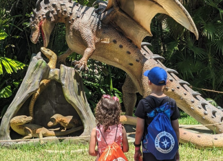 Image: Two kids enjoying the Dragons & Mythical Creatures exhibit at Fairchild Tropical Botanic Garden