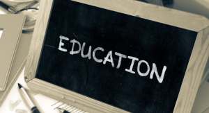 Image: A chalkboard that reads "Education"