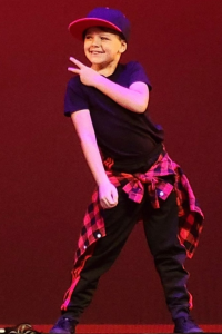 Image: A boy performing a hip-hop dance