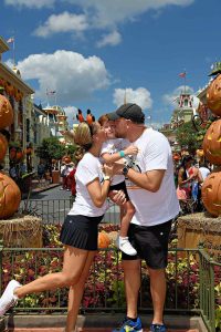 Image: A family poses for a fall-themed photo on Main Street