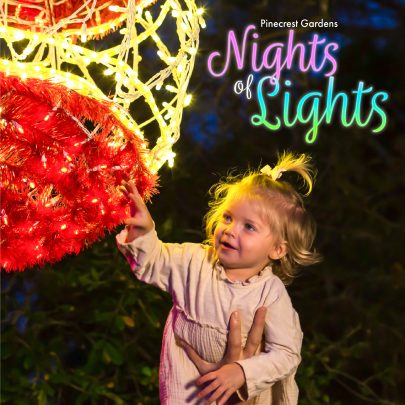 Image: A little girl enjoys a light display at Pinecrest Gardens Nights of Lights