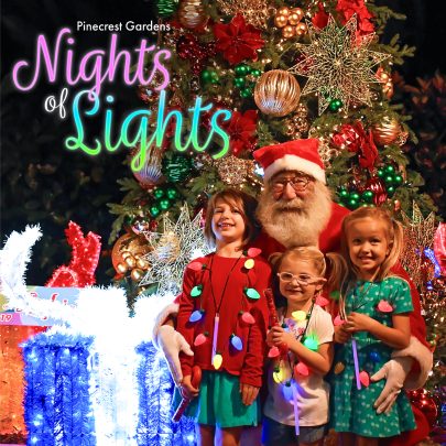 Image: Three children post for a picture with Santa at Pinecrest Gardens Nights of Lights event