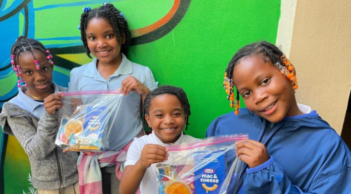 Image: Children holding snack packs assembled and distributed by Branches, a local nonprofit in Miami-Dade