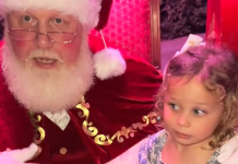 Image: Santa affirms a little girl with a message about consent after she says "No" to sitting on his lap in a TikTok video that went viral