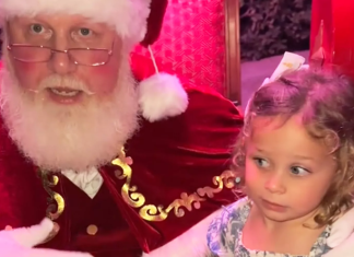Image: Santa affirms a little girl with a message about consent after she says "No" to sitting on his lap in a TikTok video that went viral