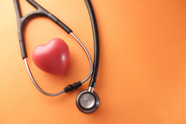 Image: A red plastic heart and a stethoscope