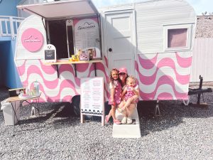 Image: Luana and her daughters pictured in front of her mobile coffee stand