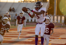 Image: A high school football player catches a touchdown