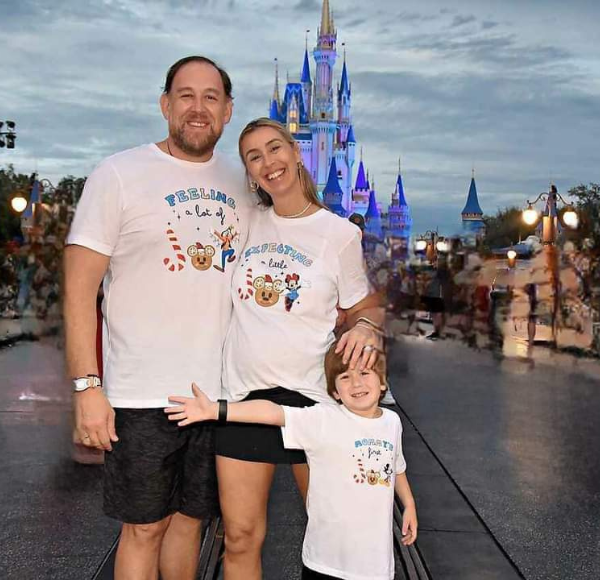 Image: Sandra with her husband and son at Disney's Magic Kingdom