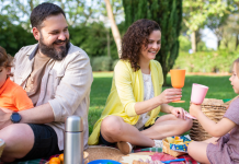 Image: A family enjoys an outdoor picnic at the park