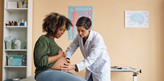 Image: An ob/gyn provides care to an expectant mother