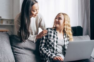 Image: A woman encourages a teenaged girl